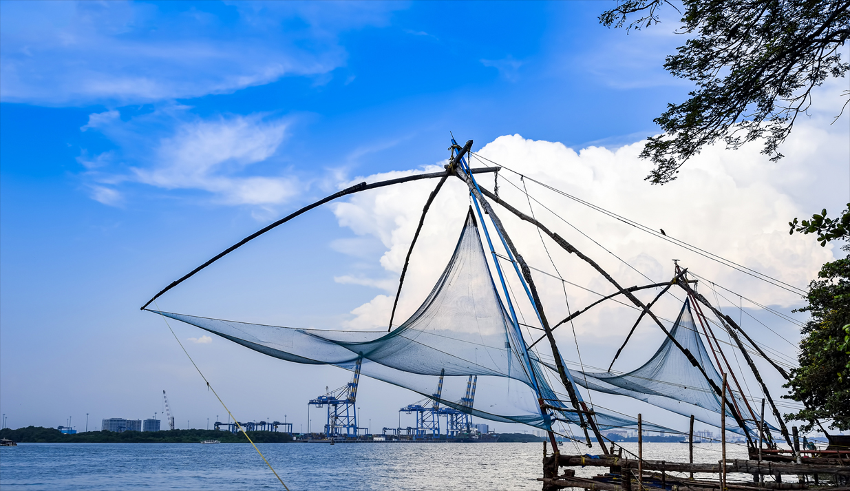 Chinese_Fishing_Nets_with_Blue_Cloudy_Sky_in_Background_at_Fort_Kochi__Kerala__India